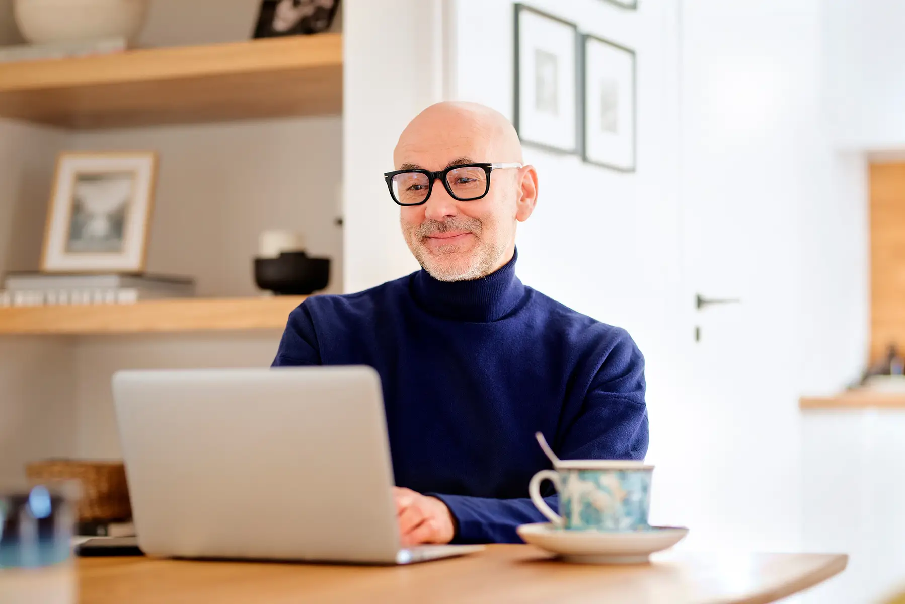 Client accessing secure portal on laptop to monitor investments and financial plans.