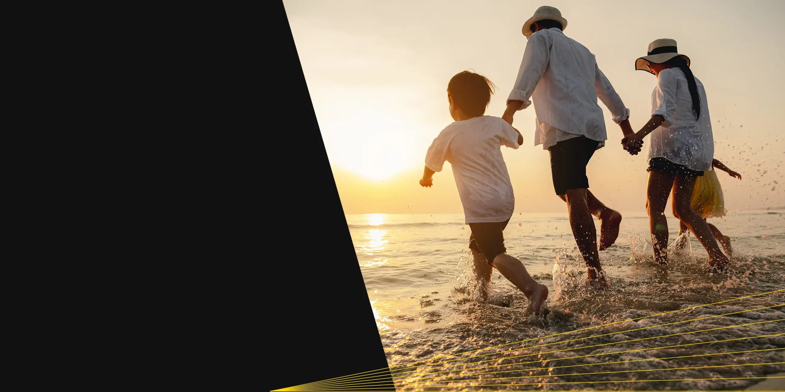Multi-generational family running on the beach.